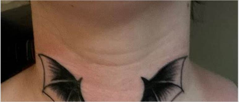 Bat wing neck tattoo